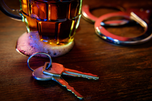 car keys next to beer for driver that will need a dui lawyer
