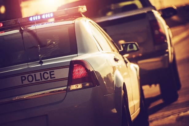 Lawyers for DUI Police car pulling someone over who will need a phoenix DUI lawyer